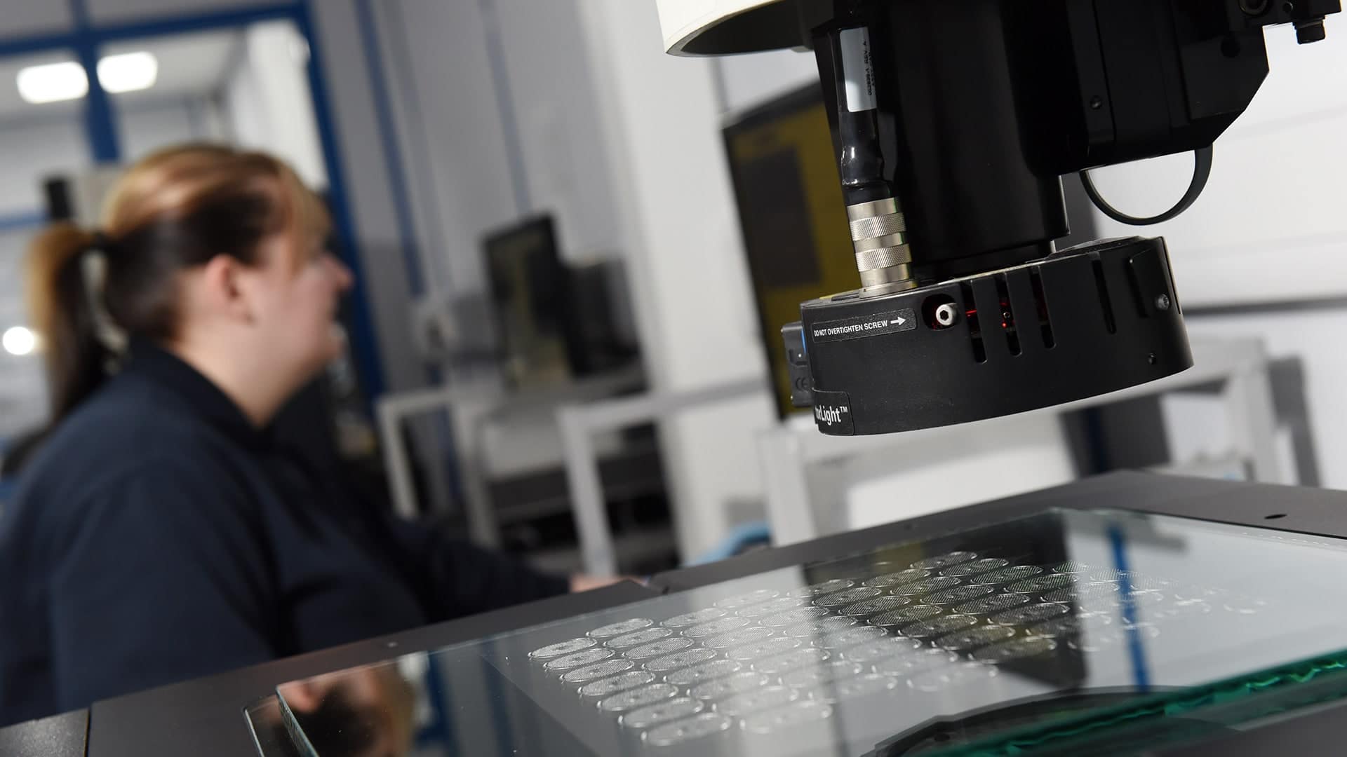 A machine inspects the quality of chemically milled components
